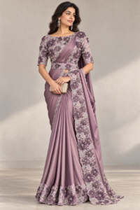 Model wearing a mauve ready-to-wear saree with a floral pallu border and matching stitched blouse.